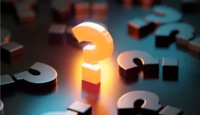 A glowing orange question mark standing upright amongst various other dark metallic question marks on a blue surface, highlighting the concept of finding answers or standing out.